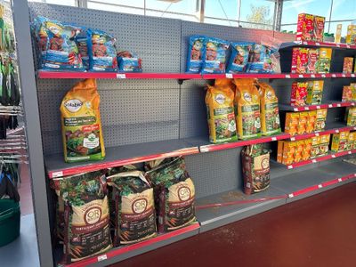 many bags of food on the shelves in the store
