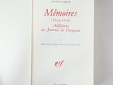 an open book with red writing on it sitting on a table