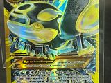the pokemon card has a yellow and black design on it