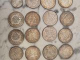 a lot of coins that are sitting on a table