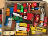 a box full of toy cars and trucks in it
