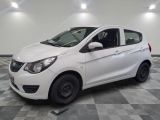 a picture of a white car parked in a garage