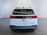 the rear end of a white volkswagen v - cross parked in a white room