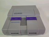 a video game console sitting on top of a white table