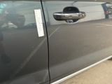 a close up of a car door handle with a sticker on it