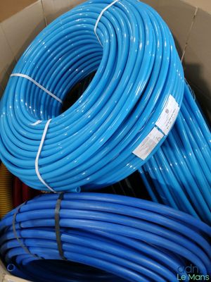 a box full of blue hoses in a box