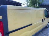 a yellow van parked in front of a building