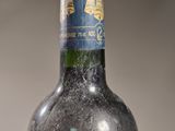 a bottle of wine that is sitting on a table