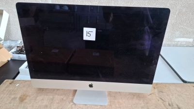 a computer monitor sitting on top of a wooden desk