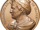 an image of a bronze medal of a man with a turban on his head