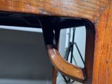 a close up of a wooden table with a handle on it