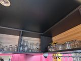 many glasses on the shelves in the kitchen
