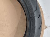a close up of a tire on a cardboard box on a table