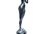 statue of a woman holding a bottle of wine on a pedestal
