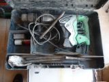 a tool box with tools inside of it on the floor