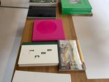 many books on a table with numbers on them
