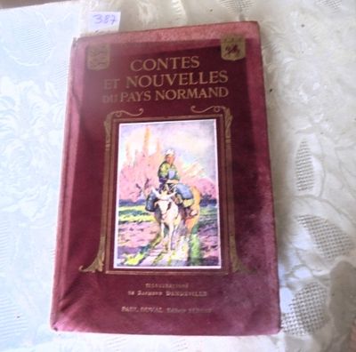 a red book with a picture of a man riding a horse