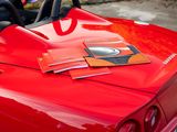 a red sports car parked on the side of the road