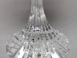 a clear glass vase with a flower inside of it