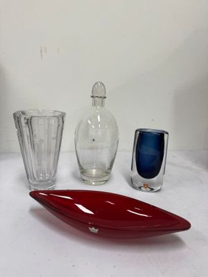 three glass vases on a table next to each other