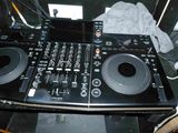a black dj controller sitting on top of a table