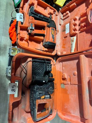 a orange case with tools inside of it on the floor