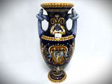 a blue vase with a gold and blue design on it