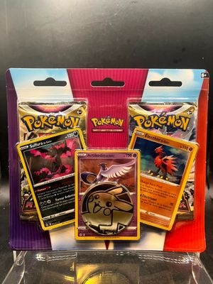 a box of pokemon cards sitting on top of a table