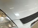 a close up of a car ' s headlight and front bumper
