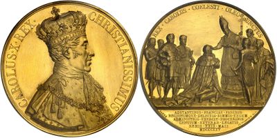 a close up of a gold coin with a woman on it