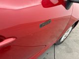 a close up of a car door handle with a sticker on it
