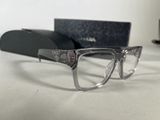 glasses are sitting on a table next to a pair of glasses