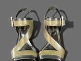 pair of women ' s shoes on a gray surface with a gray background