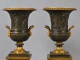 two vases that are sitting on top of each other