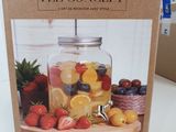 packaging of a mason jar filled with fruit on a wooden cutting board