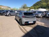 a lot of cars parked in a parking lot on a sunny day