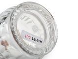 a glass jar that has a label on it