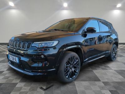 a black jeep compass parked on a checkered tile floor