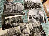 several old black and white photos of people sitting on a bed
