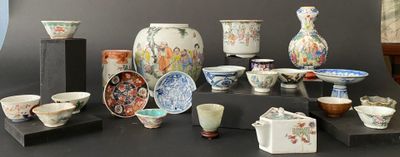 many different types of vases and bowls on the table