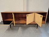an image of a wooden cabinet with two doors open