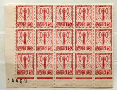 a close up of a red and white stamp on a piece of paper
