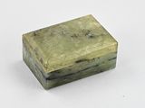 an image of a green box with a handle on a white surface