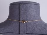 a close up of a necklace on a mannequin mannequin