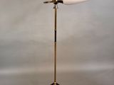 a close up of a lamp on a tripod stand with wires