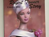 un livre sur lequel figure une poupée Barbie