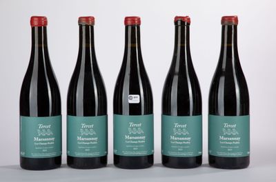 four bottles of wine are lined up in a row