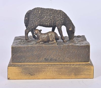 a bronze statue of a sheep and a baby sheep