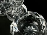 a close up of a glass object on a black surface