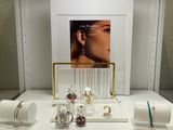 a display of jewelry on a table in a store